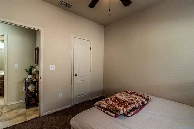 bedroom featuring dark colored carpet and ceiling fan