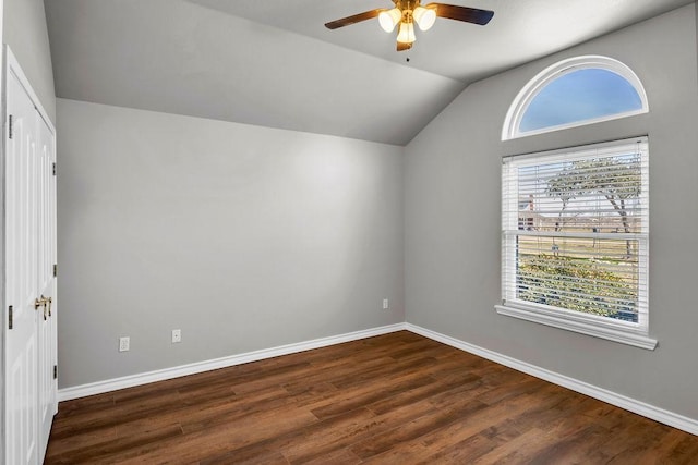 bonus room featuring vaulted ceiling, ceiling fan, dark wood-style flooring, and baseboards