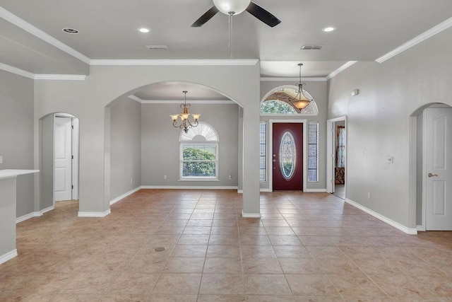 foyer with light tile patterned floors, visible vents, baseboards, arched walkways, and ceiling fan