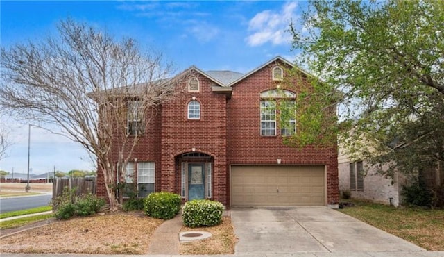 5102 Spring Brook Dr, Corpus Christi, TX 78413 - view of front of house with a garage, concrete driveway, and brick siding