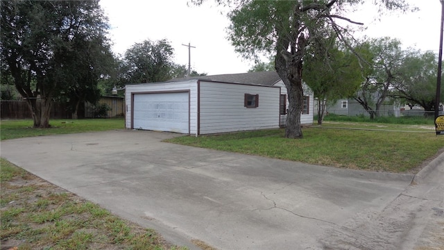 garage with a yard