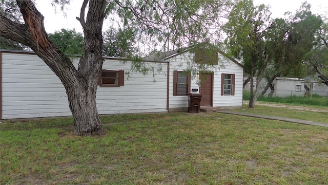 ranch-style house with a front lawn