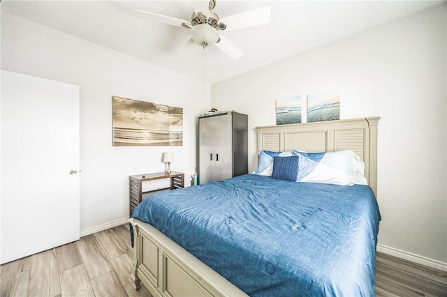 123 E Cora Lee Dr Unit 301, South Padre Island, TX 78597 - bedroom featuring light wood-style floors, baseboards, and ceiling fan