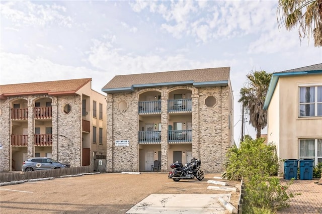 123 E Cora Lee Dr Unit 301, South Padre Island, TX 78597 - view of apartment building / complex featuring uncovered parking