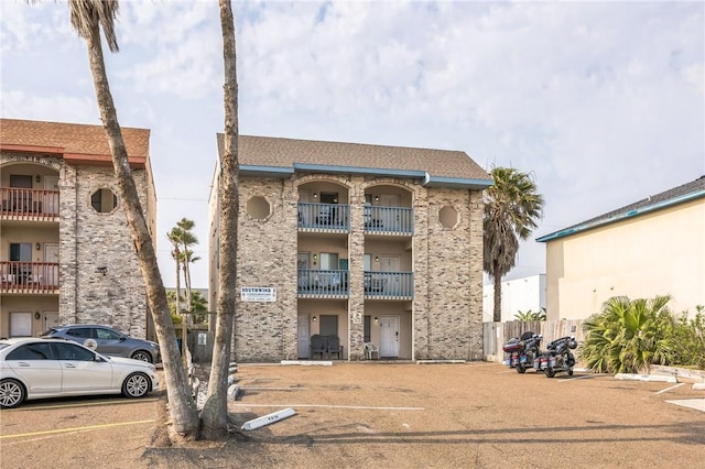 123 E Cora Lee Dr Unit 301, South Padre Island, TX 78597 - view of apartment building / complex featuring uncovered parking