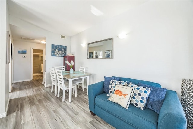 123 E Cora Lee Dr Unit 301, South Padre Island, TX 78597 - living area with wood finished floors and baseboards