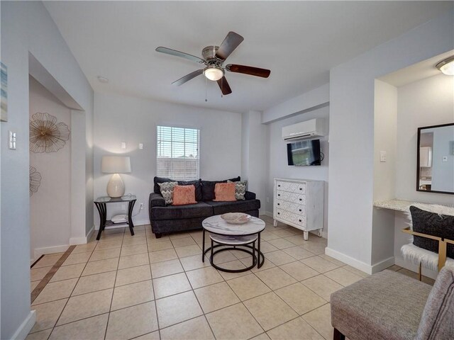 514 Royal Palm Dr, Port Aransas, TX 78373 - living room with an AC wall unit, ceiling fan, light tile patterned flooring, and baseboards
