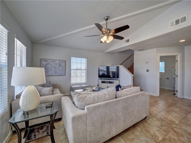 514 Royal Palm Dr, Port Aransas, TX 78373 - living area with vaulted ceiling, a ceiling fan, stairs, light tile patterned floors, and baseboards