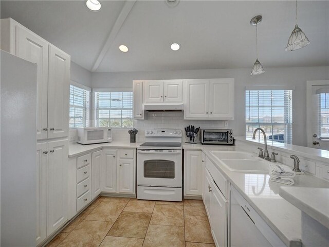 514 Royal Palm Dr, Port Aransas, TX 78373 - kitchen with white appliances, under cabinet range hood, a sink, healthy amount of natural light, and recessed lighting