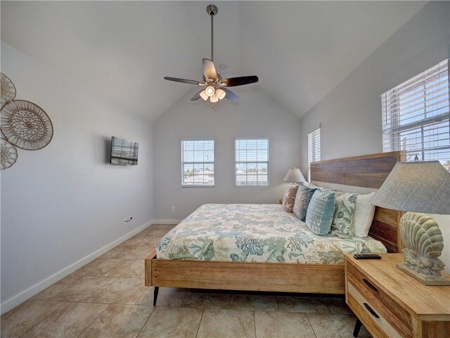 514 Royal Palm Dr, Port Aransas, TX 78373 - bedroom featuring vaulted ceiling, baseboards, light tile patterned floors, and ceiling fan