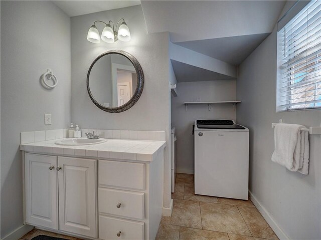 514 Royal Palm Dr, Port Aransas, TX 78373 - bathroom featuring washer / clothes dryer, baseboards, vanity, toilet, and vaulted ceiling