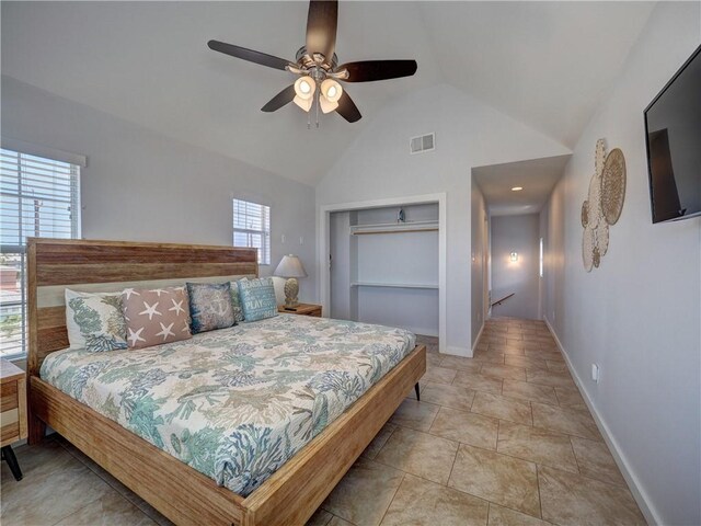 514 Royal Palm Dr, Port Aransas, TX 78373 - bedroom with multiple windows, baseboards, a ceiling fan, a closet, and high vaulted ceiling