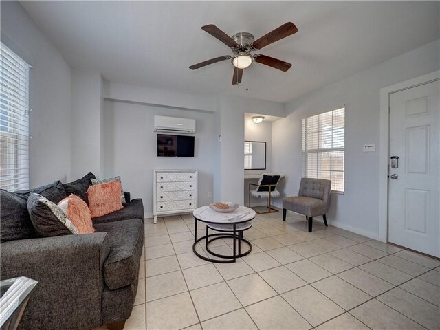 514 Royal Palm Dr, Port Aransas, TX 78373 - living room with an AC wall unit, light tile patterned flooring, a ceiling fan, and baseboards