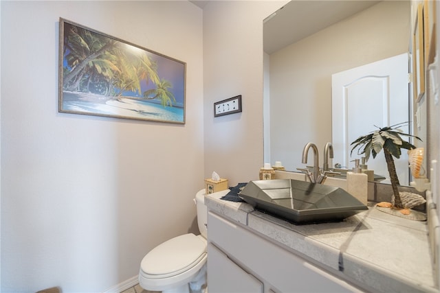 bathroom with vanity and toilet