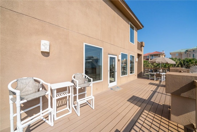 113 Sea Air Ln, Port Aransas, TX 78373 - wooden deck featuring outdoor dining area