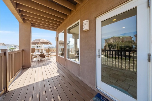 113 Sea Air Ln, Port Aransas, TX 78373 - wooden terrace featuring outdoor dining area