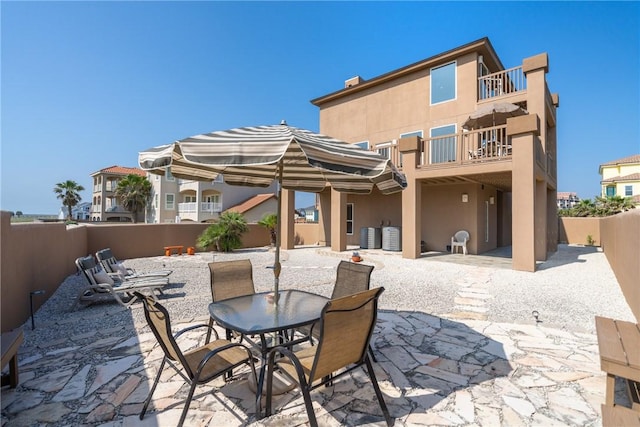 113 Sea Air Ln, Port Aransas, TX 78373 - patio / terrace with a fenced backyard, a patio area, and outdoor dining space