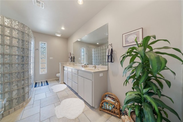 113 Sea Air Ln, Port Aransas, TX 78373 - full bathroom featuring double vanity and recessed lighting