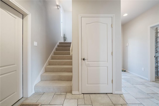 113 Sea Air Ln, Port Aransas, TX 78373 - stairway with recessed lighting and baseboards