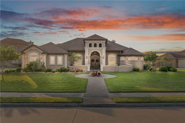 8401 Lago Vista Dr, Corpus Christi, TX 78414 - view of front of house with a front yard and stucco siding