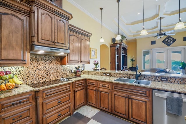 8401 Lago Vista Dr, Corpus Christi, TX 78414 - kitchen with stainless steel dishwasher, a sink, under cabinet range hood, decorative backsplash, and pendant lighting