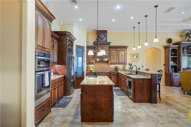 8401 Lago Vista Dr, Corpus Christi, TX 78414 - kitchen featuring crown molding, stainless steel appliances, a peninsula, arched walkways, and backsplash