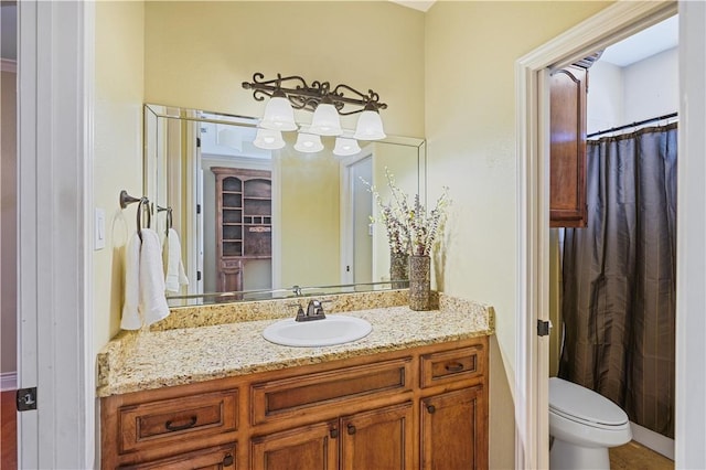 8401 Lago Vista Dr, Corpus Christi, TX 78414 - bathroom featuring vanity, toilet, and a shower with curtain