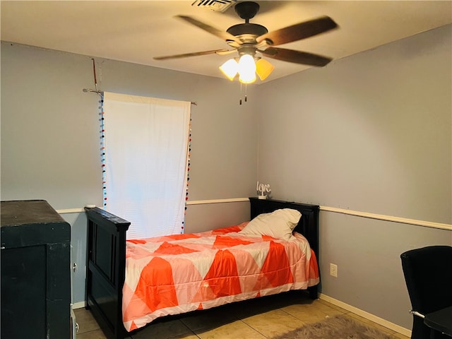 tiled bedroom with ceiling fan