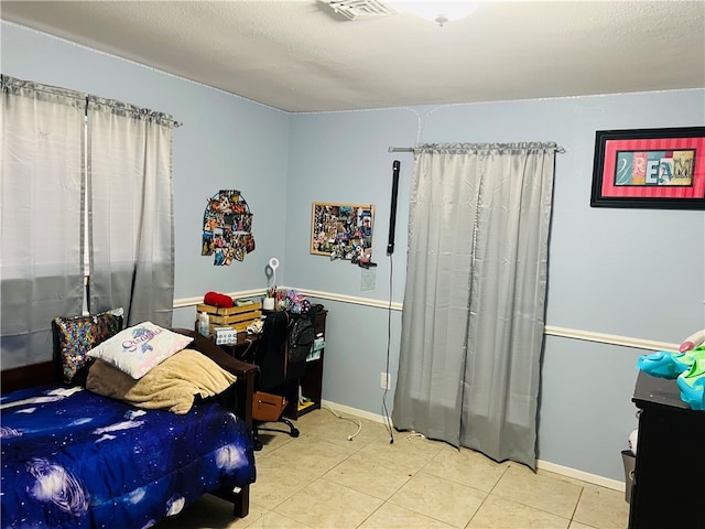 bedroom featuring tile patterned flooring