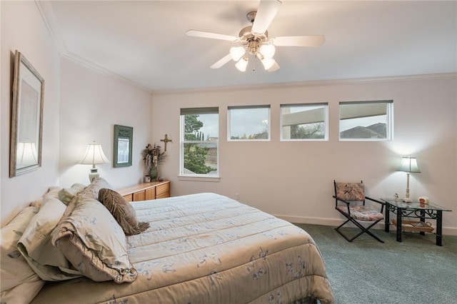 carpeted bedroom featuring ceiling fan, baseboards, and ornamental molding