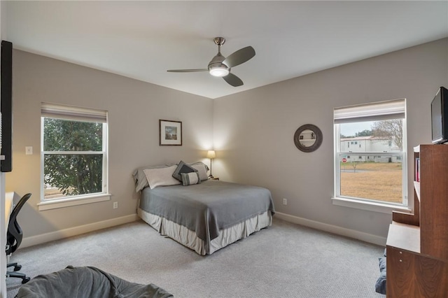 bedroom featuring a ceiling fan, baseboards, and carpet floors