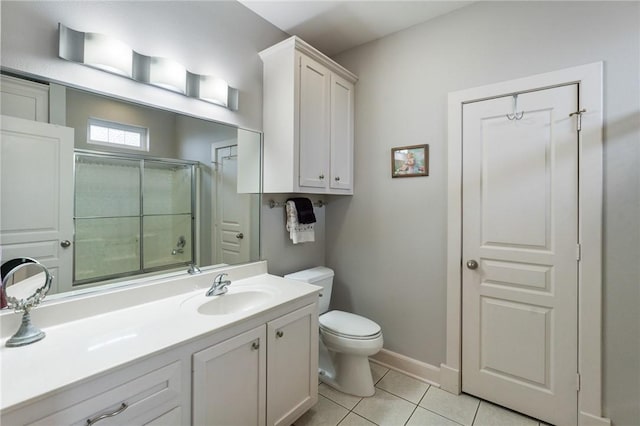 bathroom with an enclosed shower, toilet, tile patterned flooring, baseboards, and vanity