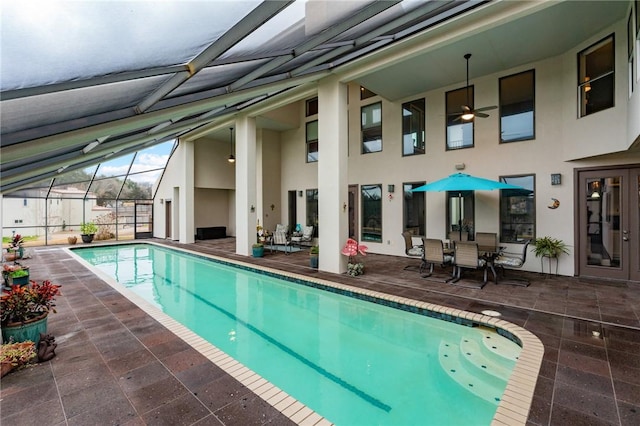 pool with a lanai and a patio