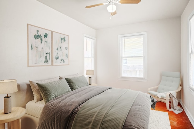 bedroom with hardwood / wood-style flooring and ceiling fan