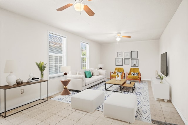 tiled living room with ceiling fan