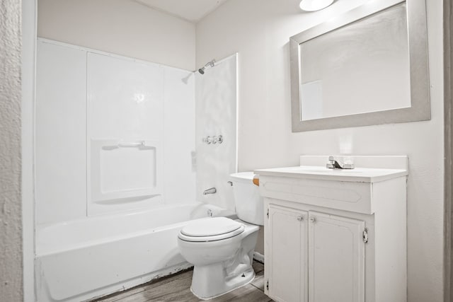 full bathroom with vanity, hardwood / wood-style flooring, toilet, and  shower combination