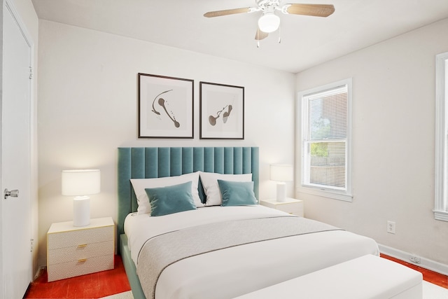 bedroom with hardwood / wood-style flooring and ceiling fan