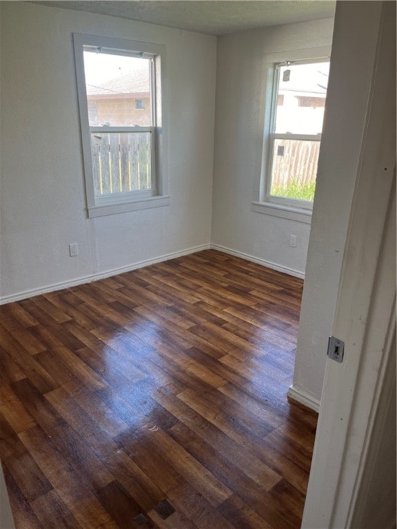 empty room featuring dark hardwood / wood-style floors