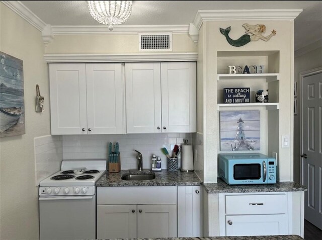 3938 Surfside Blvd Unit 1326, Corpus Christi, TX 78402 - kitchen featuring white electric range, a sink, ornamental molding, tasteful backsplash, and dark stone counters