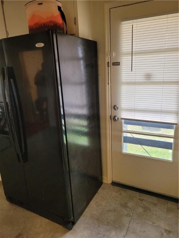 kitchen featuring black fridge