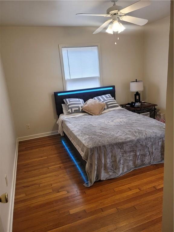 bedroom featuring wood-type flooring and ceiling fan