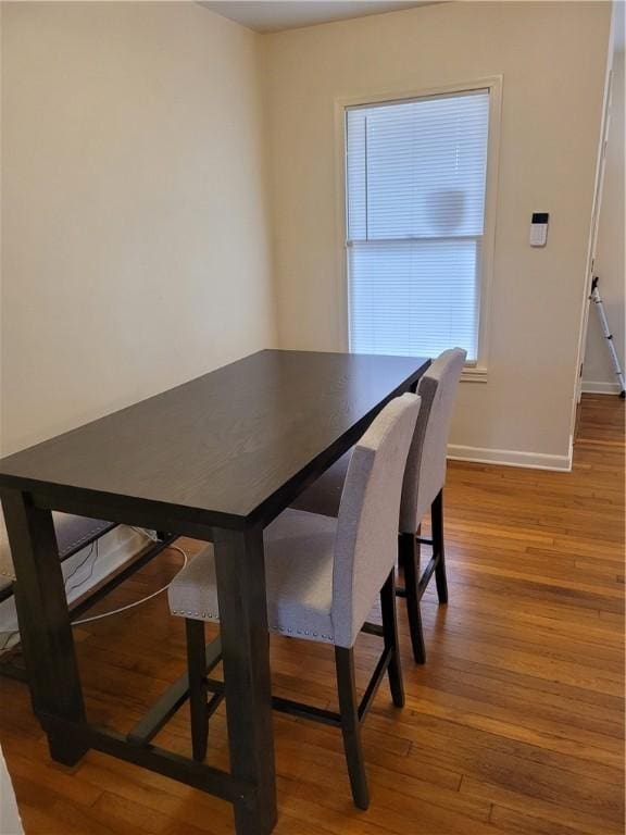 dining area featuring hardwood / wood-style flooring