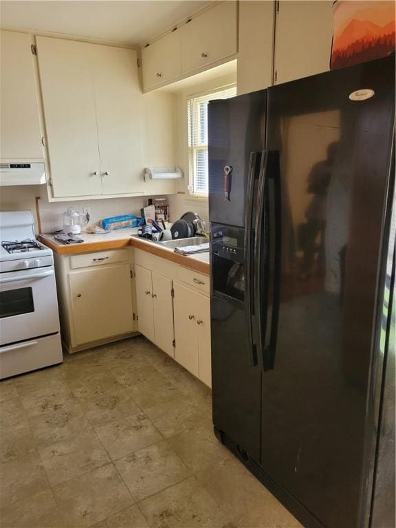 kitchen featuring white cabinetry, white gas range oven, sink, and black refrigerator with ice dispenser