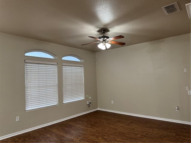 spare room featuring ceiling fan and a textured ceiling