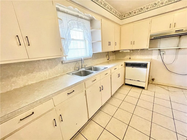 419 Washington Ave, Robstown, TX 78380 - kitchen featuring white dishwasher, open shelves, light countertops, tasteful backsplash, and light tile patterned floors