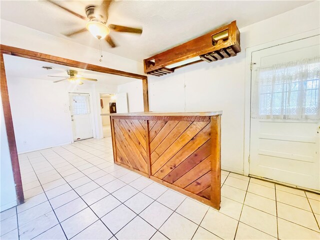 kitchen with light tile patterned floors and ceiling fan