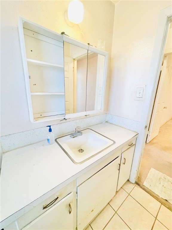 bathroom with vanity and tile patterned flooring