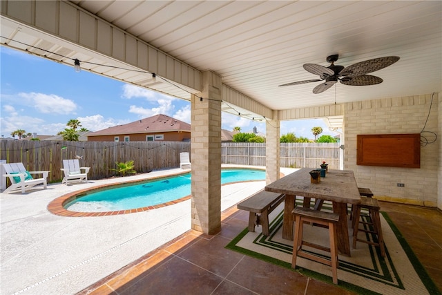 15822 Portillo Dr, Corpus Christi, TX 78418 - view of swimming pool with a patio area, ceiling fan, a fenced backyard, and outdoor dining space