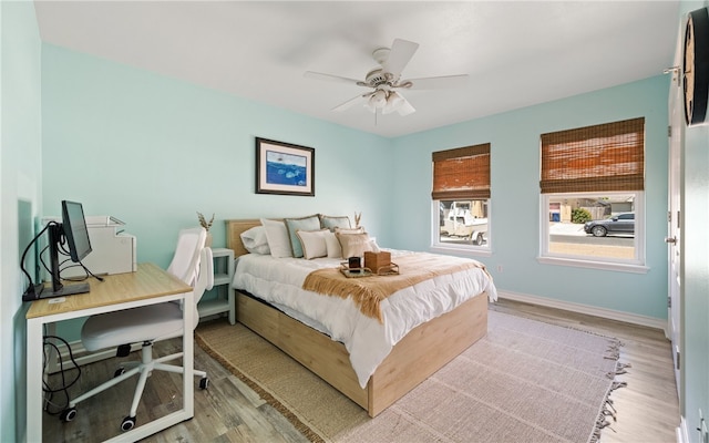 15822 Portillo Dr, Corpus Christi, TX 78418 - bedroom with wood finished floors, ceiling fan, and a desk