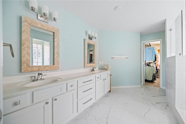 15822 Portillo Dr, Corpus Christi, TX 78418 - full bath with double vanity, marble finish floors, and a walk in closet